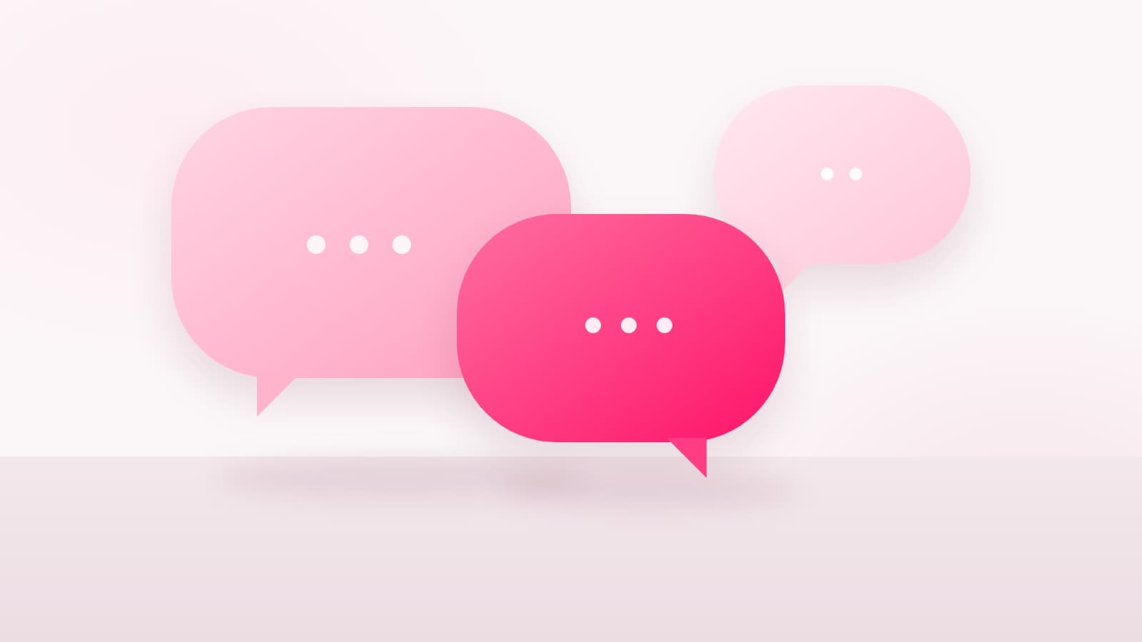 Three overlapping speech bubbles in different sizes and shades of pink on a pale surface, for a post on brand deals for Hindi, Tamil and Telugu creators in India